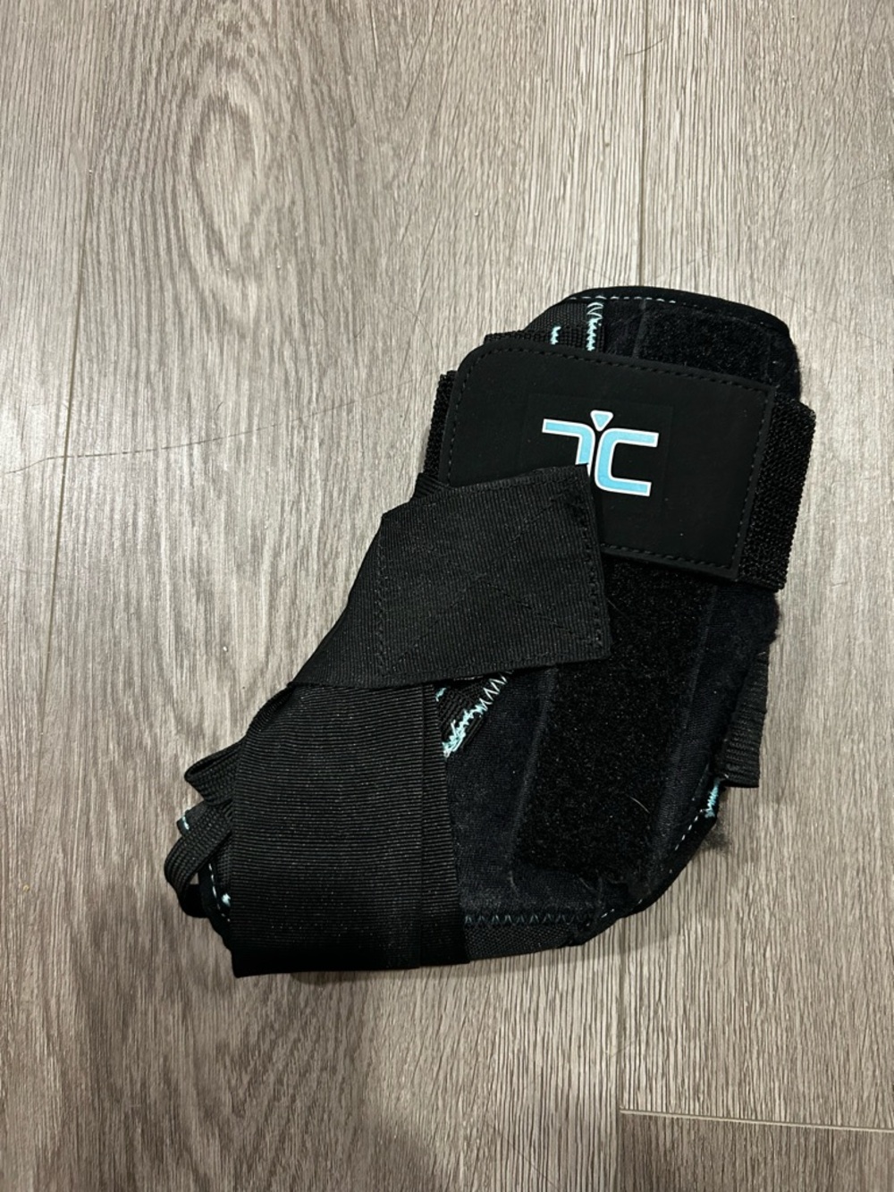 Therapeutic Ankle Brace with Logo - Black with Light Blue Accent